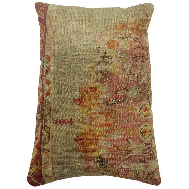 Pillow made from a vintage turkish oushak rug in soft gray' blue and pinks and red border on 1 side. 16'' x 23'