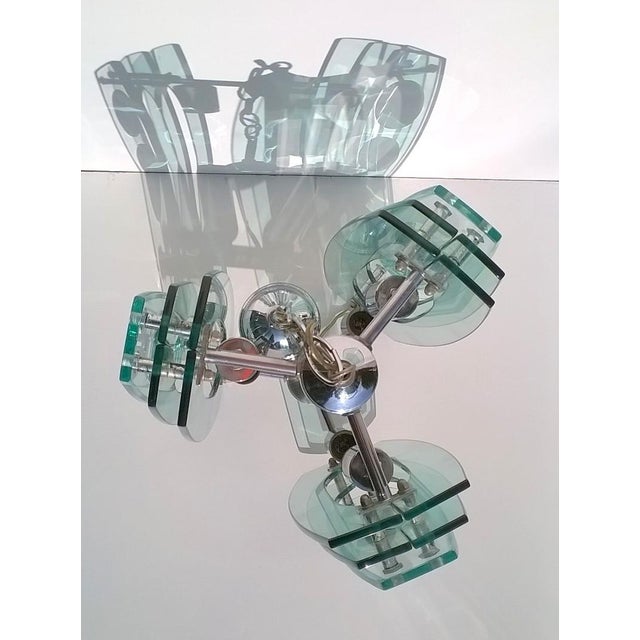 Pendant light made in Italy by VECA, Cassano d'Adda,Milano,1970s, in a style reminiscent Fontana Arte. The frame is made...