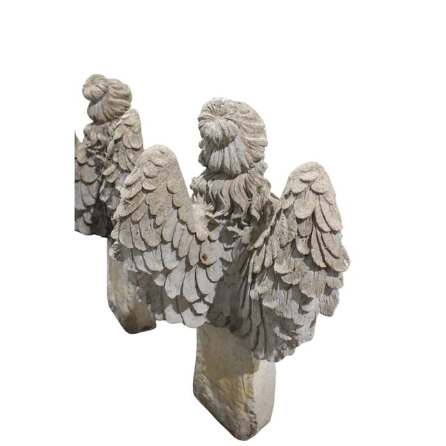 A charming and unusual cast stone garden sculpture depicting a sitting angel. Beautifully crafted with exceptional detail,...