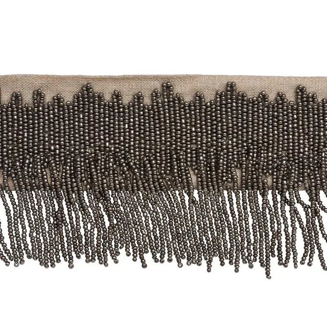 Gleaming hand beaded fringe on a linen ground makes for a glamorous statement without any flash or fuss. Sold as a 2-yard...