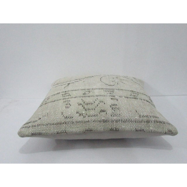 Decorative pillow cover made from a vintage Turkish handknotted rug. Backed with good quality cotton fabric. Pillow...