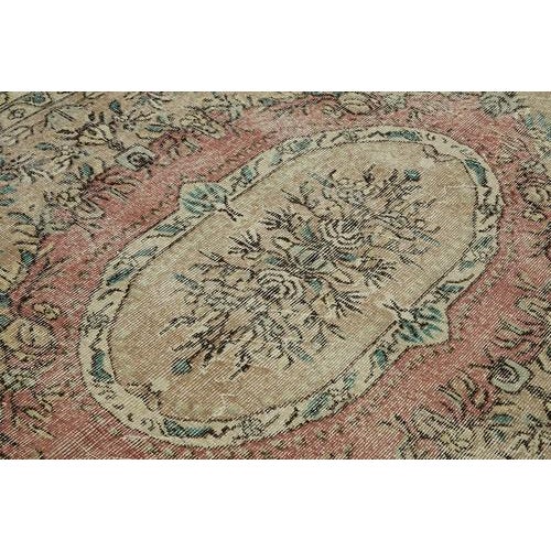 This stunning piece is part of our curated collection of vintage rugs, crafted from authentic hand-knotted Turkish rugs...