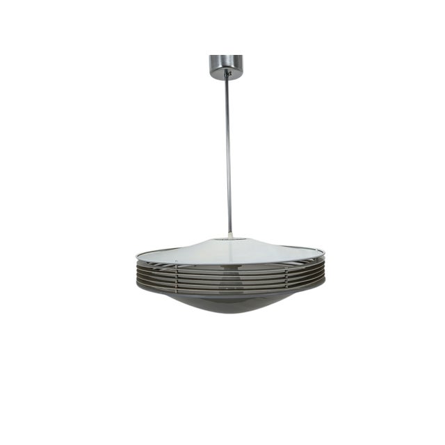 This stunning stilnovo pendant lamp, a true icon of 1950s italian design, perfectly embodies the spatial and rationalist...