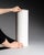Tall cylindrical floor vase in matte white bisque porcelain with a rhythmic relief of abstract glyph-like motifs. The...