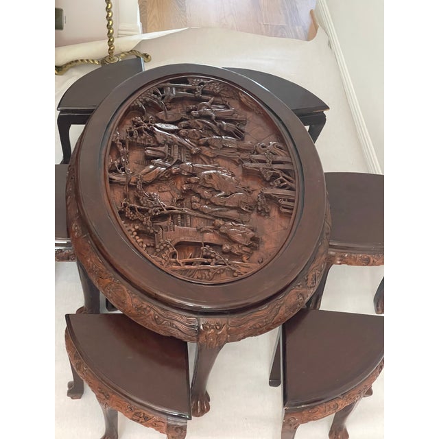 Gorgeous antique Chinese handcarved coffee table with 6 matching smal chairs and glass top. Great decorative furniture set.