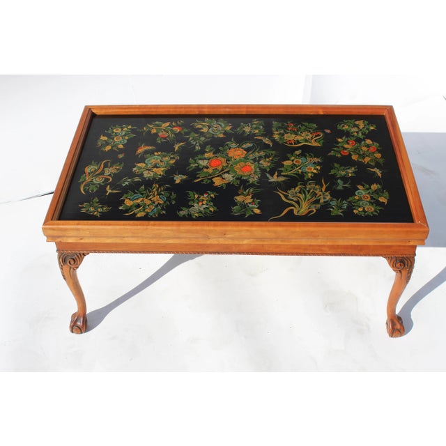 Custom English style black lacquer coffee table with mahogany legs. Made in the late 20th century.