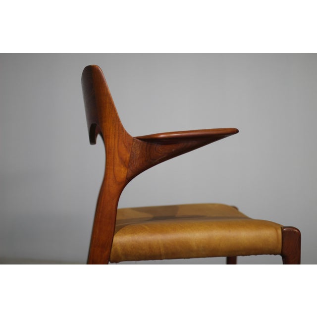 Model 55 armchair in teak, designed by Niels O. Moller in 1951 and produced by J.L. Mollers Mobelfabrik, Denmark. This...