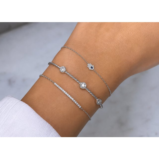 Elevate your jewelry collection with this refined and effortlessly layered luxury bracelet stack by BE LOVED, designed to...