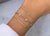 Elevate your jewelry collection with this refined and effortlessly layered luxury bracelet stack by BE LOVED, designed to...