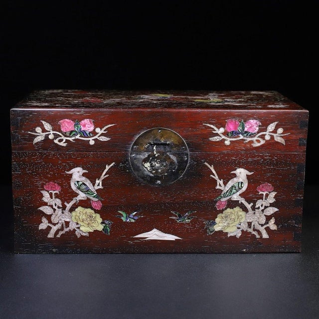 A beautifully crafted Chinese rectangular box, likely made of Zitan wood. The box features a hinged lid with brass...