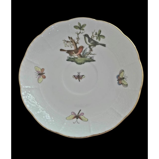 The Herend Rothschild Bird 5.75" scalloped 24K gold edge saucer is a vintage porcelain piece. This multicolor saucer...