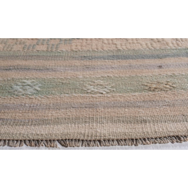 This vintage Turkish flat weave Kilim is hand-woven. The simplicity and boldness of this piece can also give a...