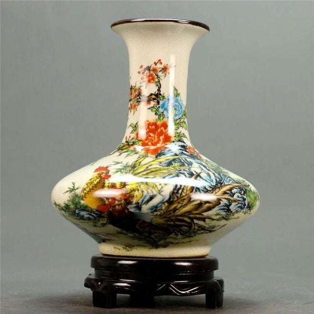 Add a touch of rustic charm and auspicious symbolism to your home with this beautifully painted porcelain vase. Featuring...