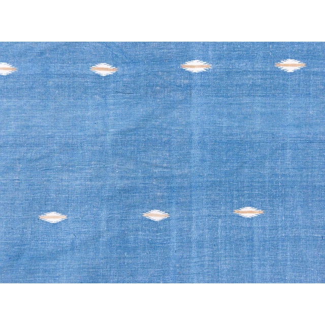 This striking mid-20th century Indian Dhurrie rug is a beautiful example of minimalism in traditional flat-weave textiles....