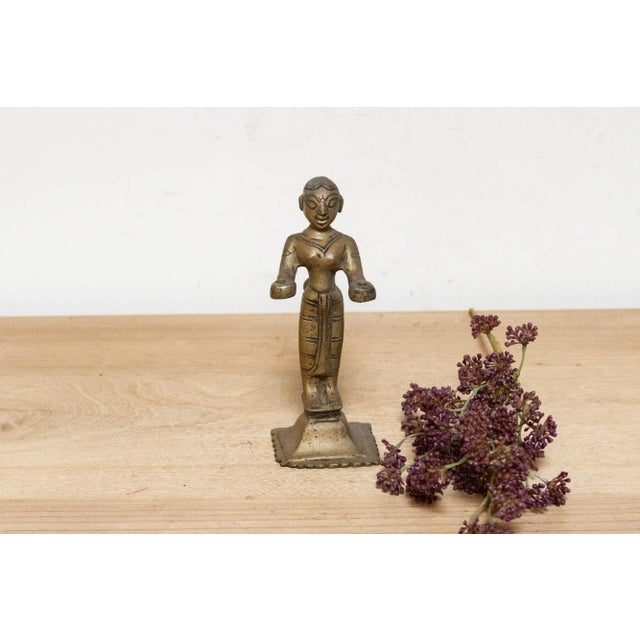 Enchanting 19th century Indian oil lamp, this unique oil lamp features the goddess Dipa Lakshmi standing gracefully atop a...