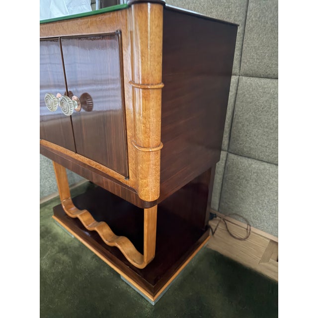 Pari of sculptural Art Deco revival Late art deco inspired nightstands or side cabinetrs featuring rich dark mahogany...