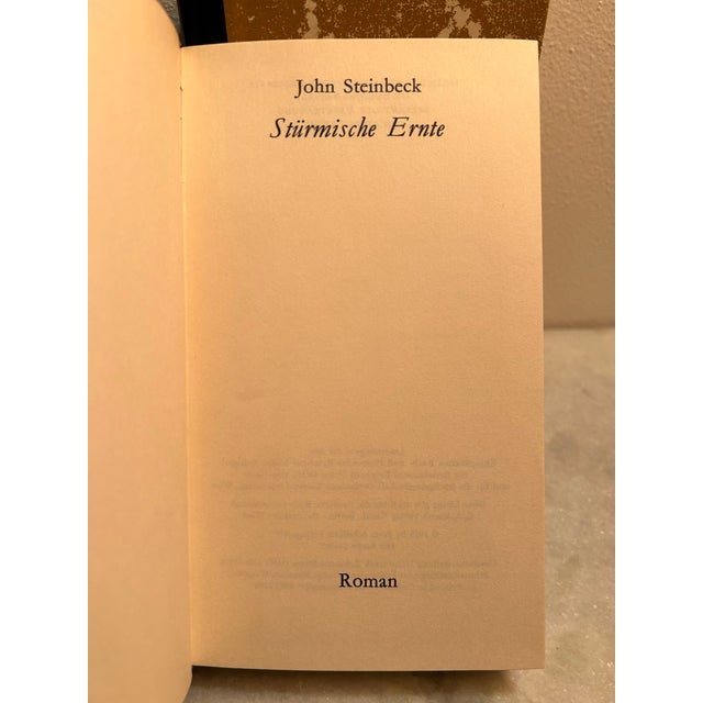 John Steinbeck’s classic novels- all hardcover. printed in German. Titles include: Cannery Row (cardboard/ paper cover) In...