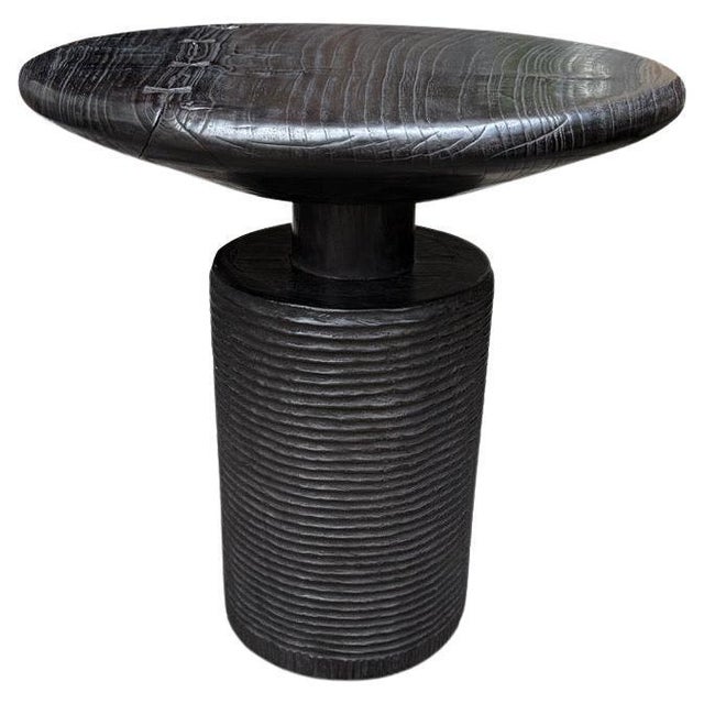 A century old mortar originally used to grind rice is repurposed into this unique side table or entrance table featuring...