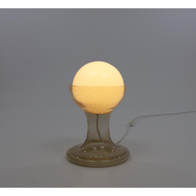 LT 215 table lamp designed by Carlo Nason and manufactured in the 1960s by Murano glassmaker A.V. Mazzega. The lamp is...
