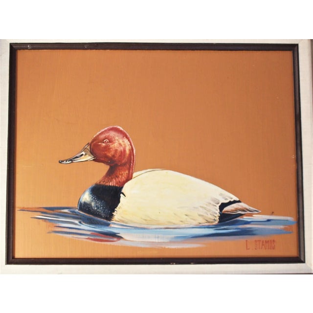 A contemporary painting of a wild duck painted on board. Artist is Luke Stamos. Measures: overall 23 ½” x 19 ½”, painting...