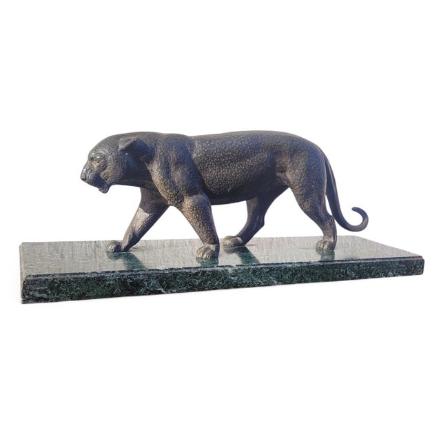 Large bronze panther with a brown patina, walking on a green marble base Good overall condition, some scratches and chips...