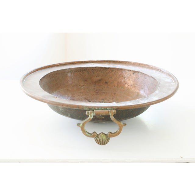 Early 19th C. French hammered cooper bowl with decorative swing brass handles. Time-worn character and verdigris green...