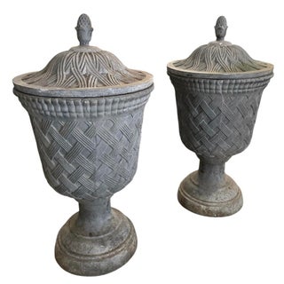 Pair of Neoclassical Style Basketweave Lead Garden Urns With Finial Lids For Sale