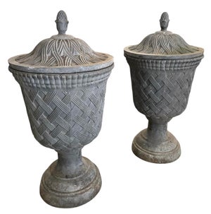 Pair of Neoclassical Style Basketweave Lead Garden Urns With Finial Lids