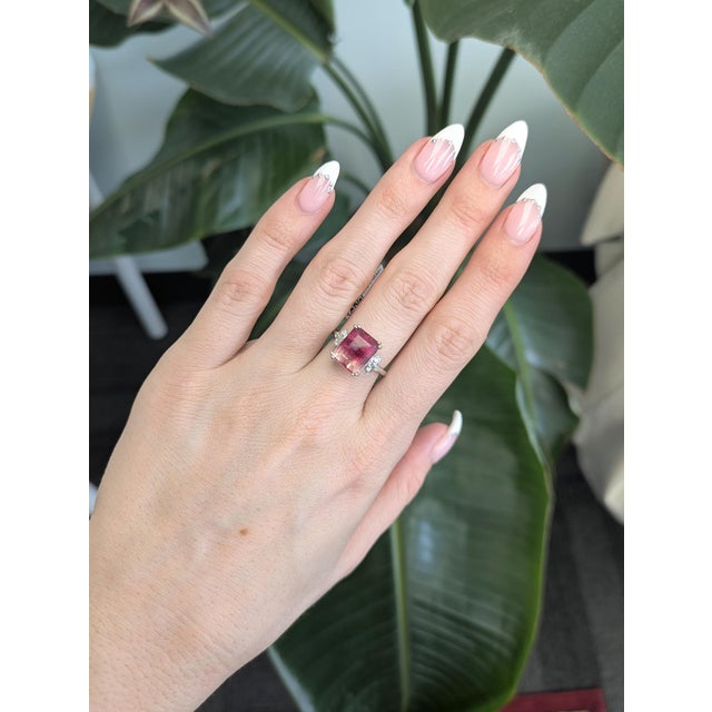 5.1ct bi-color tourmaline set in solid 14k gold, showcasing its vibrant dual hues for a striking statement. Accented with...