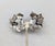 1950s silvertone overlapping leaves of oak, maple and water lily butterfly clip back earrings. Marked "NAPIER PAT. PEND."...