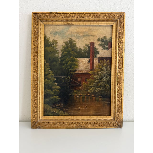 Original antique American school oil painting on canvas dated 1887, depicting a peaceful riverside landscape with a rustic...