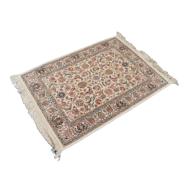 Vintage Karastan 100% wool area rug / mat / carpet featuring a floral motif inspired by palmettes and scrolled vines with...