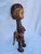 Authentic vintage African tribal figure, hand-carved from solid wood and accented with natural leather ties. This unique...