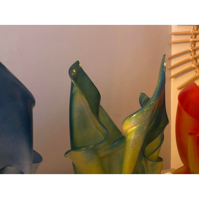 A striking collection of three vintage French sculptural decorative pieces, comprising two table lamps and a matching...