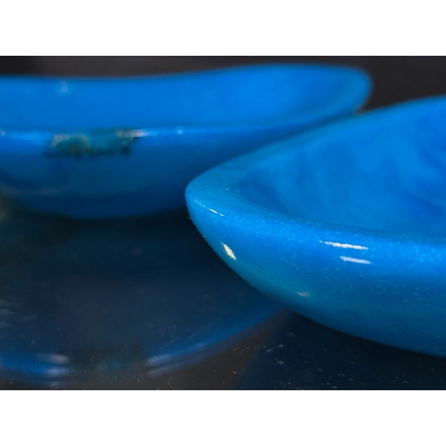 These two Italian alabaster catchalls are dyed a vivid cerulean blue that highlights the natural veining of the stone,...