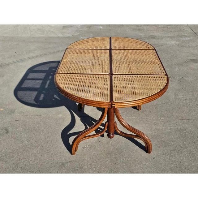 In this listing you can find a beautiful and very rare Mundus dining table, done in solid wood, with rattan top and glass...
