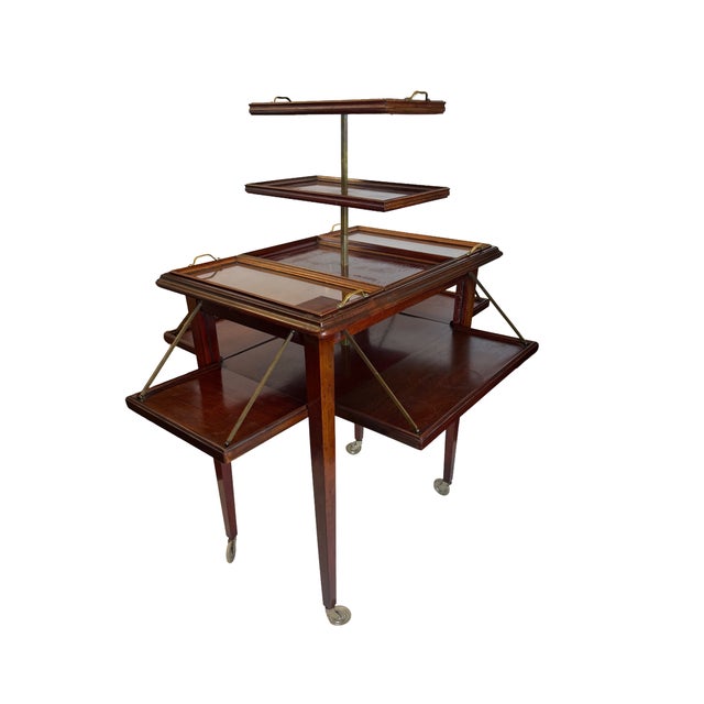 Elegant English Regency Revival mahogany folding butler’s table / étagère featuring an ingenious three-tier elevating...