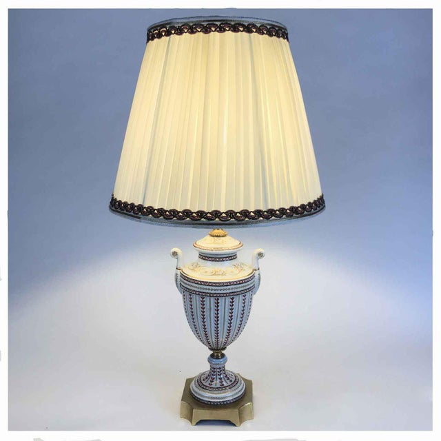 Decorated Porcelain Table Lamp consisting of a white porcelain vase with handles hand-decorated with geometric motifs in...