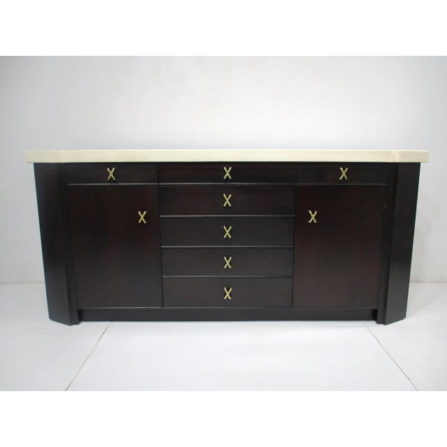 A very well crafted mahogany sideboard chest with cork top having a door to each side with shelve , two upper divided and...