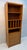 Vintage Danish modern bookcase crafted in warm-toned teak, featuring a streamlined silhouette with gently curved side...
