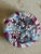 A striking mid-20th-century vintage art glass paperweight featuring a dense, vibrant close-pack concentric millefiori cane...