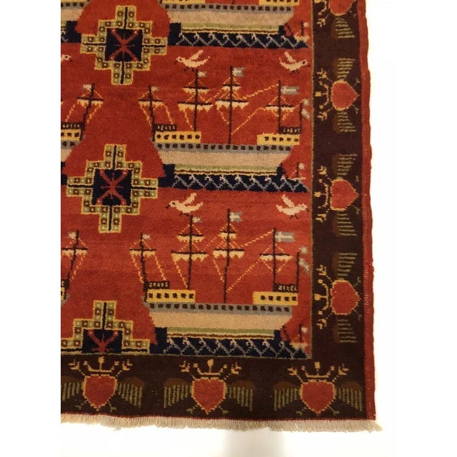 A unusual, double sided rug from Scandinavia, signed a dated: ''LST 1934''. The flags on the ships are from the Shetland...