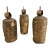 Set of vintage cast brass bells with a heavy, solid feel and aged patina. These have a simple cylindrical form with iron...