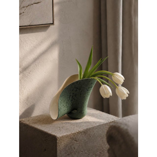 A breathtaking abstract biomorphic studio ceramic vase signed by the artist and dated '54 — placing its creation firmly in...