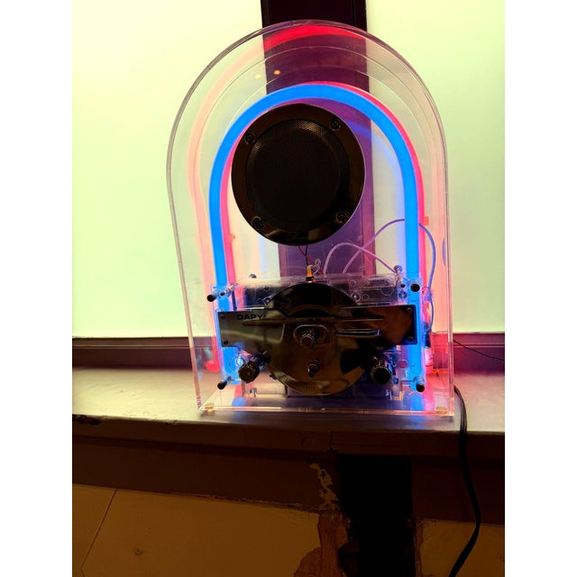 **Transparent DAPY Radio Sculpture – Vintage Electronics Display** A striking transparent radio housed in a clear acrylic...