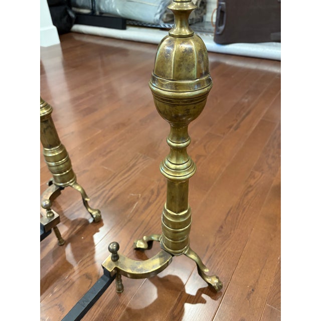 Pair of antique brass American fireplace andirons from the 19th century. Acorn finial tops. Highly desirable traditional...