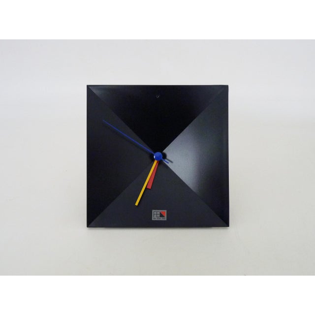 Postmodern Black Table Clock by Shiseido Japan, 1980s A perfectly black table clock from the 1980s with yellow, red and...