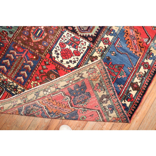 an early 20th Century Persian Bakhtiari Rug with a fun, colorful garden box pattern. rug no. j2605 size 10' 8" x 13' 6"...