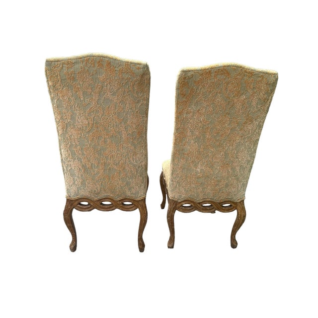 The set of two Pretzel Ribbon Back Hollywood Regency French Provincial Rococo dining chairs typically feature elegant and...