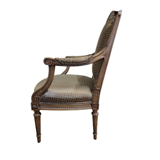 A Fine 19th century French Walnut Fauteuil with profusely carved moldings around the back and seat rails, the arm rest...
